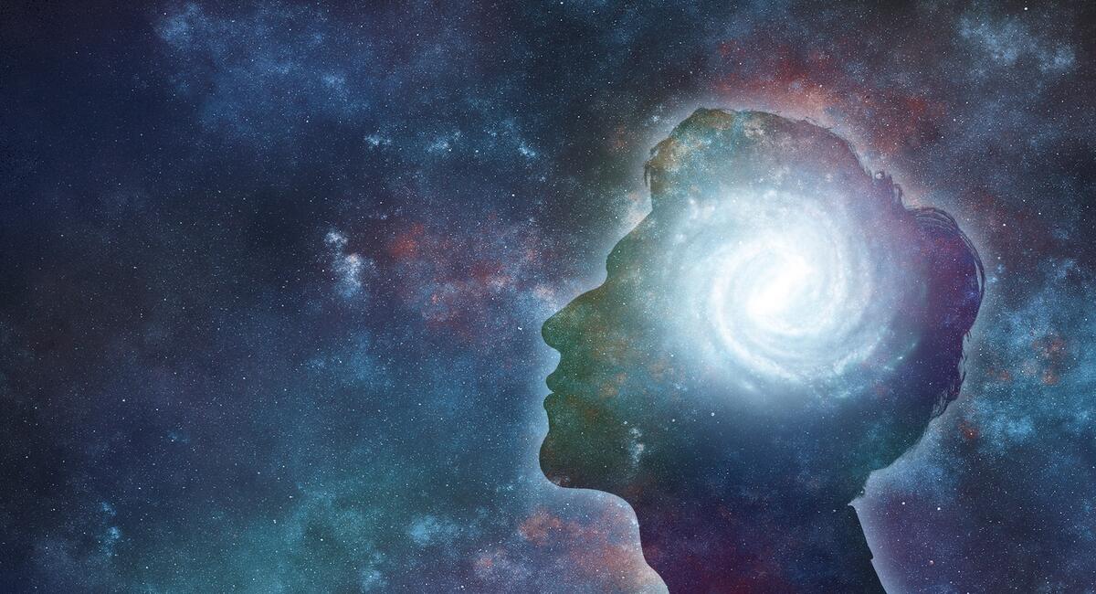 A human head with a swirling cosmos placed where the brain would be. the background is of space. this represents vicente llp working with psychedelics and emerging therapies.